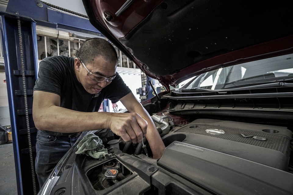 man working on car