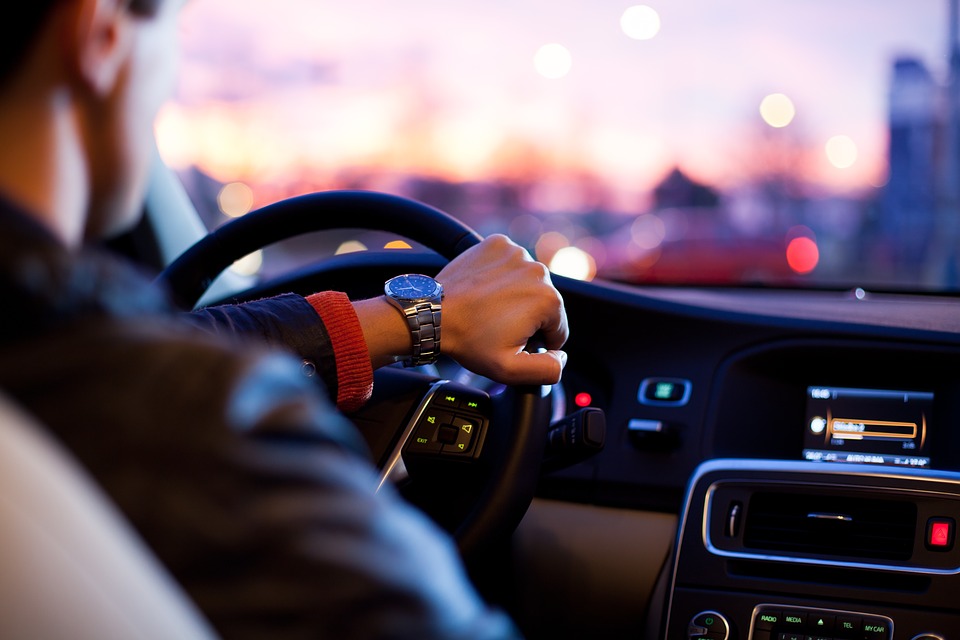 man driving in city