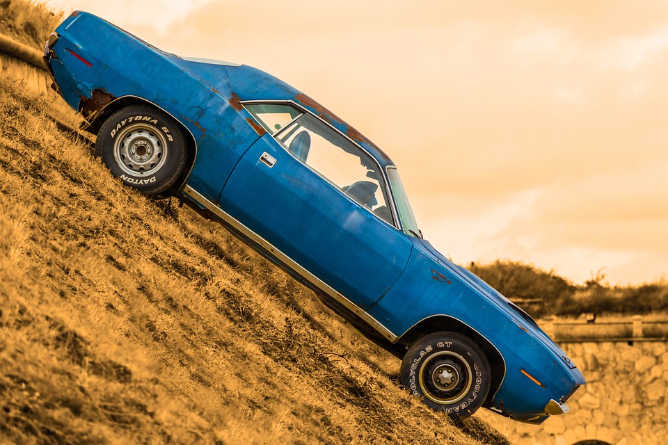angled image of a 60s blue Chevy Camaro with Daytona SR tires and Polyglas GT Goodyear tires