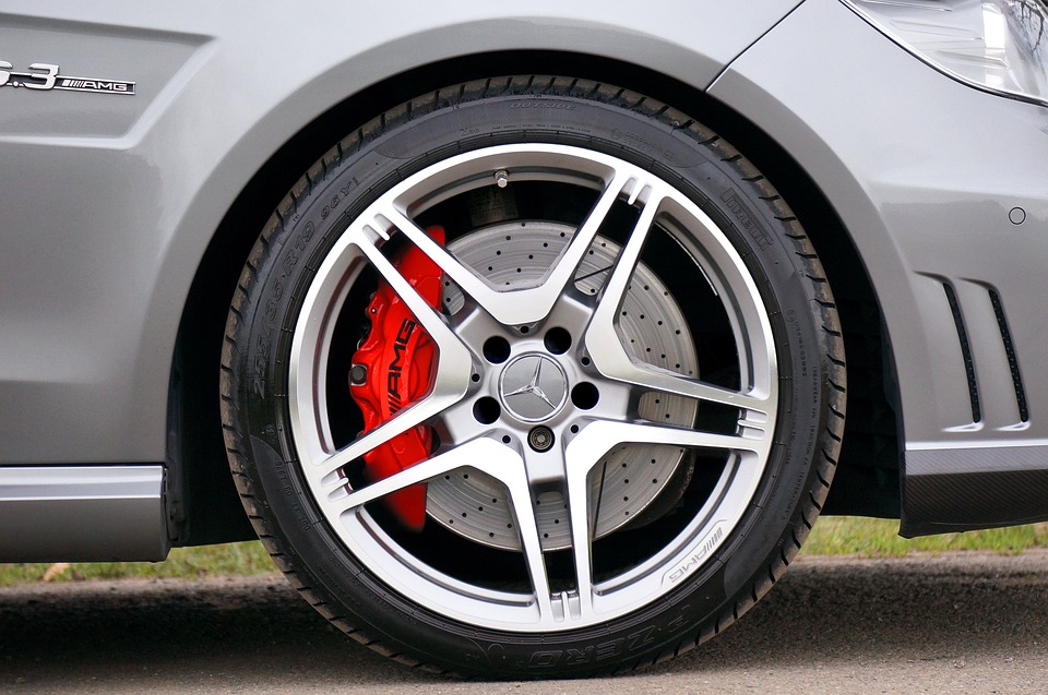 Close-up of Mercedes-Benz AMG wheel and brake caliper, highlighting performance and design