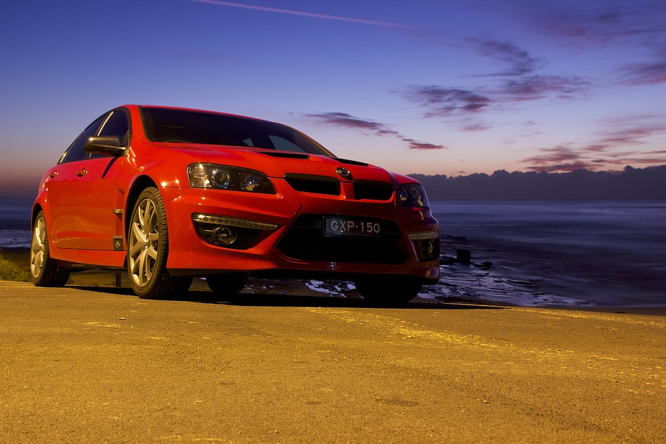 red GXP parked on a dirt road