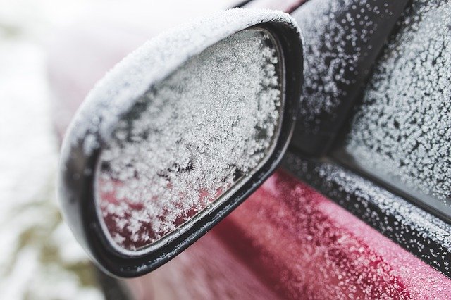 snow on vehicle side mirror