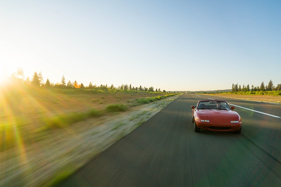 car driving in sunset