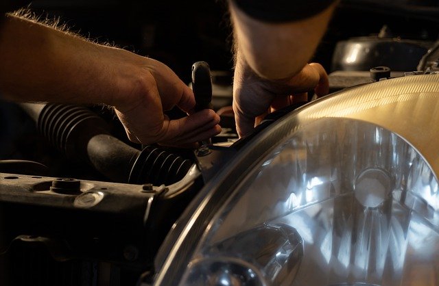 mechanic working on radiator