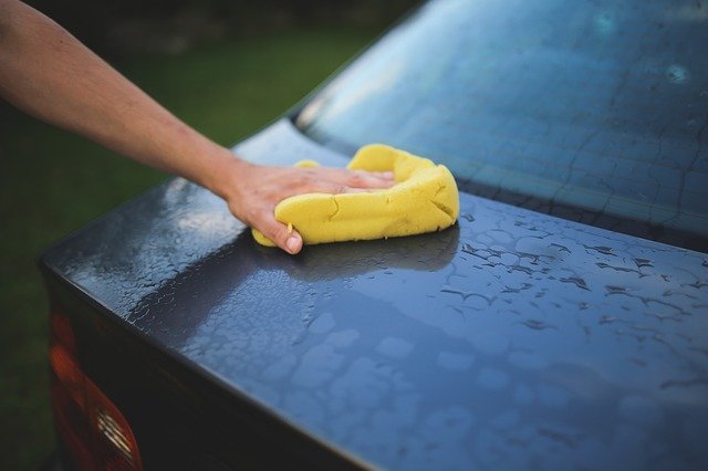 drying wet car with cloth