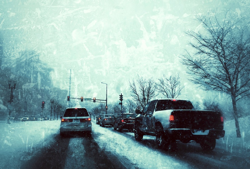 Cars driving in snowy weather: winter driving safety tips, navigating icy roads, cold weather vehicle prep