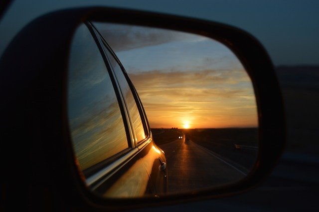 sunset in car side mirror